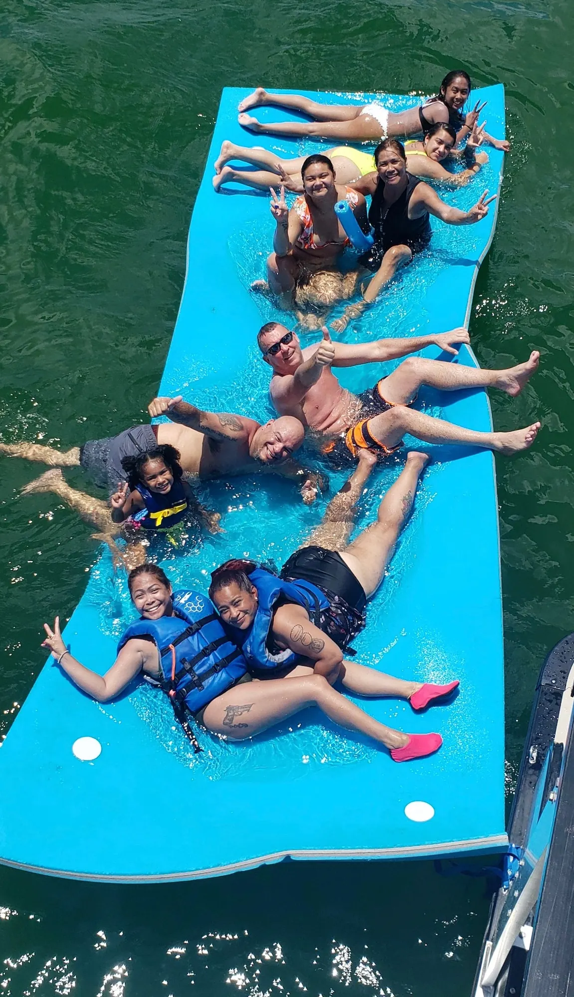 Guests relaxing on the floating mat
