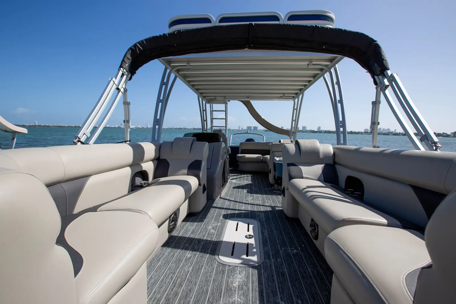 Tritoon lounge seating and upper deck stairs